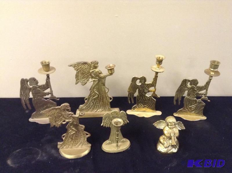 lot 38 image: Grouping of Brass Angel Candle Holders