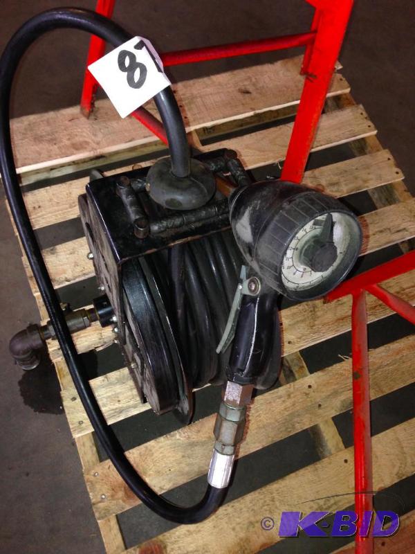 Retractable fluid hose reel with dispenser gu...