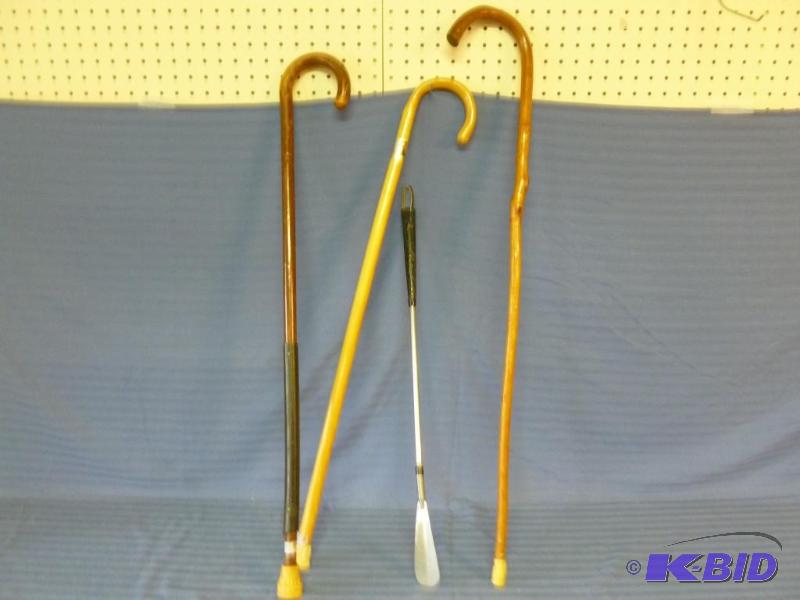 lot 100 image: Lot of three wooden canes and a long handled ...