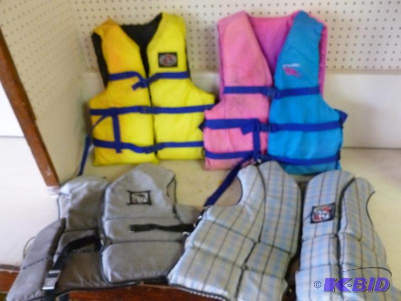 lot 107 image: Lot of four adult sized life jackets, include...