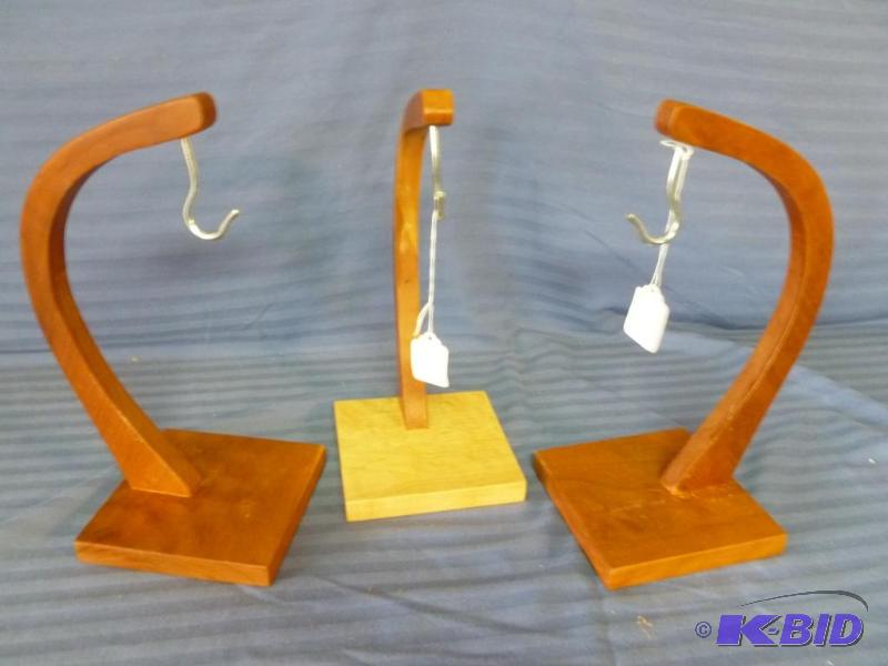 lot 133 image: Lot of three hand crafted wooden banana hange...