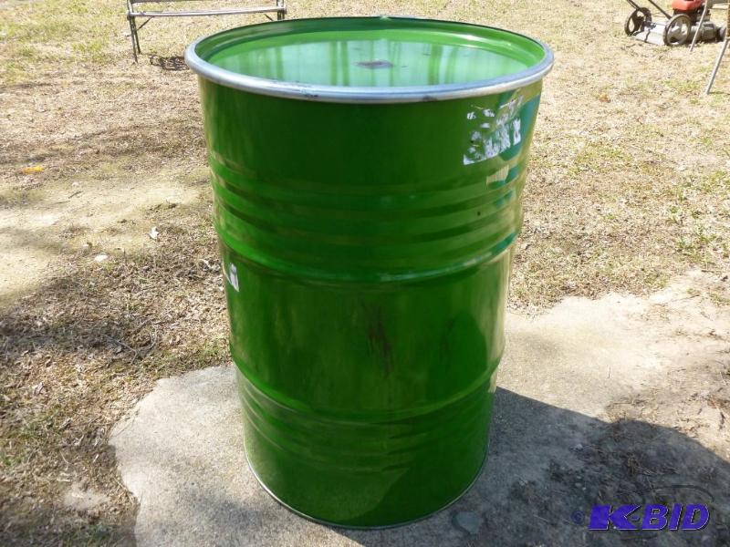 lot 66 image: Large 55 gallon steel barrel, comes with a to...