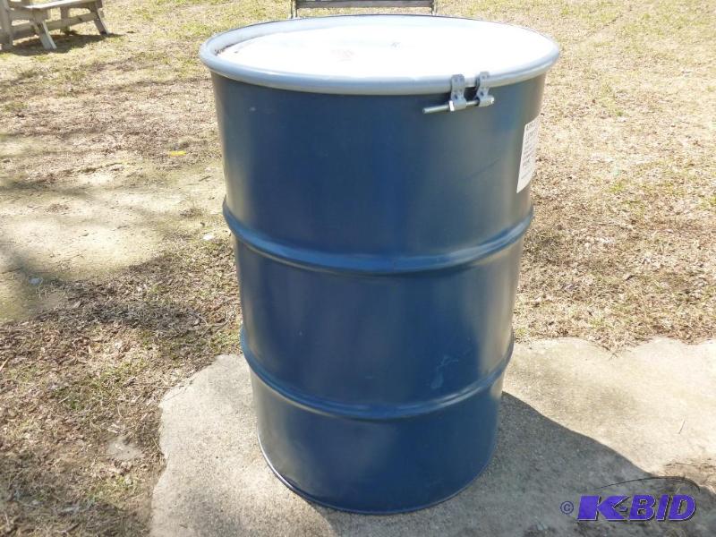 lot 67 image: Large 55 gallon steel barrel, comes with a to...