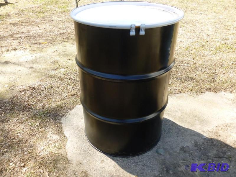 lot 71 image: Large 55 gallon steel barrel, comes with a to...