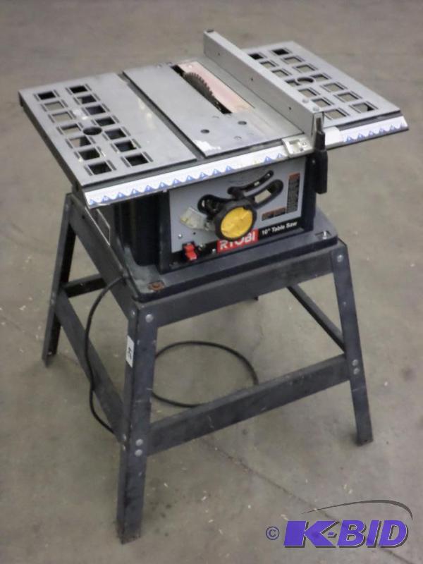 lot 29 image: Ryobi 10" Table Saw With Stand...