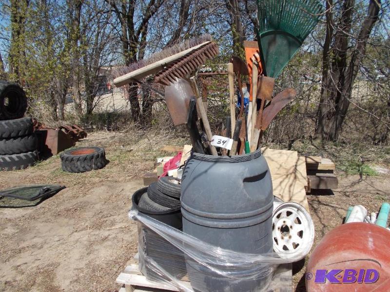 lot 34 image: Pallet with Yard Tools, Rims, & Misc....