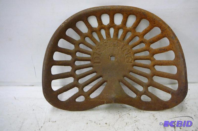 lot 72 image: Antique Deering Tractor Seat Cast Iron...