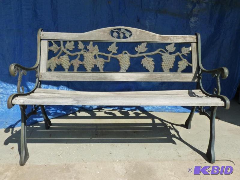 lot 38 image: Heavy duty cast iron framed and wood seat par...