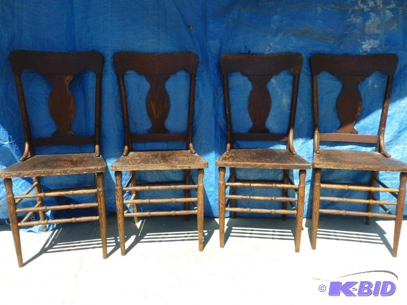 lot 8 image: Lot of four vintage wooden chairs, measures a...