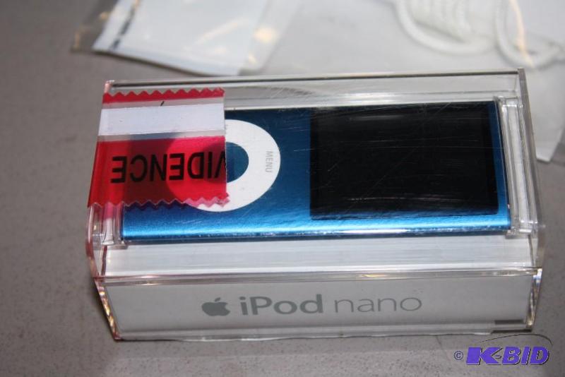 lot 141 image: Lot of (2) Including IPod Nano In Case, Metallic Blue IPod Shuffle.