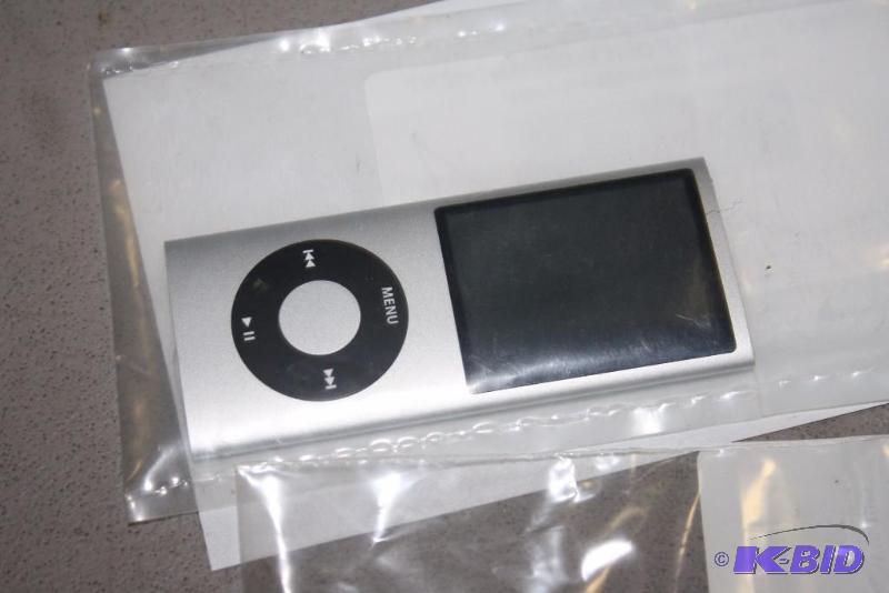 lot 142 image: Lot of (3) Including IPod Nano, Metallic Silver IPod Shuffle Samsung ECX130 Camera.