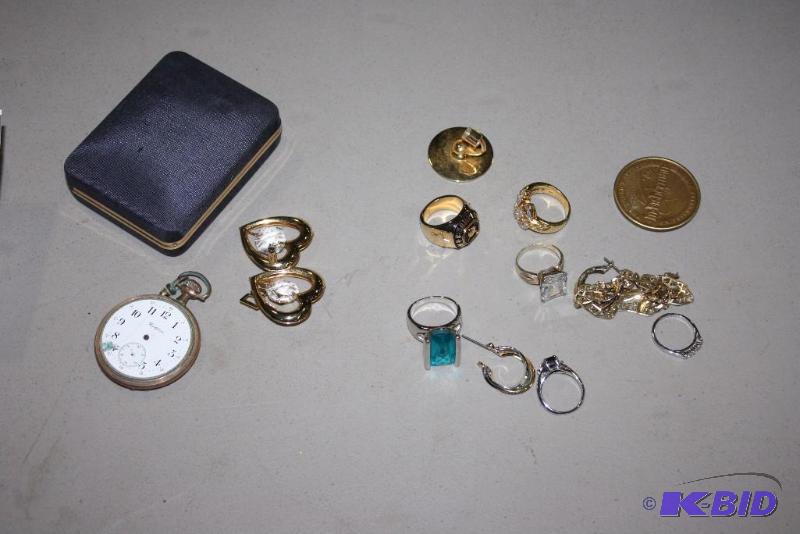 lot 144 image: Lot of Miscellaneous Jewelry Including Rings Hair Clip Pocket Watch And More.