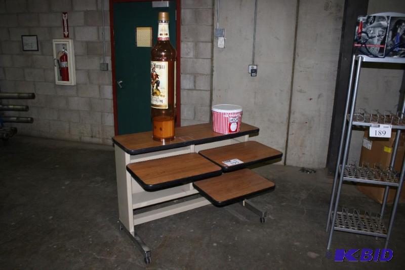 lot 195 image: Lot of (3) Including (1) Desk, 48x28x33 (1) Captain Morgan Plastic Bottle, 37x9 and More.