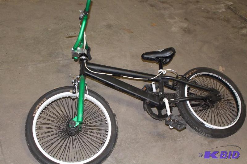 lot 514 image: Mongoose Bicycle 16 Rims BlackGreen.