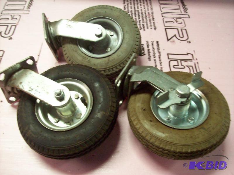 lot 36 image: 3 tires on rim and mounting bracket. 1 with l...