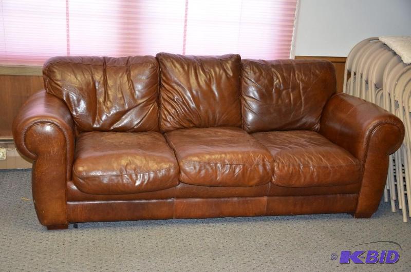 lot 3 image: Leather Down Couch. Owner paid $3500 . Please...