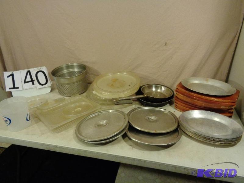 lot 140 image: Lot of lids, metal plates with wood holders, ...