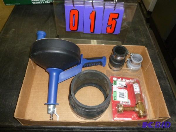 Flat of drain cleaner and pipe couplers. As s...