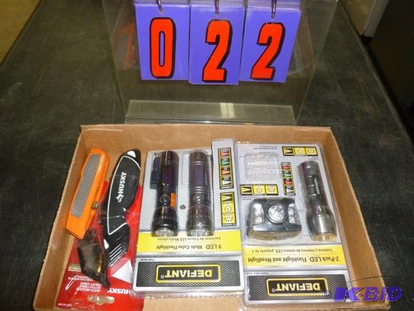 Flat of knives and flashlights. As shown. Ter...