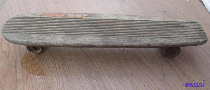 lot 113 image: Vintage skateboard. Wooden deck and metal whe...