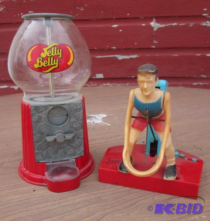 lot 114 image: Gum ball machine and a vintage shotput toy in...