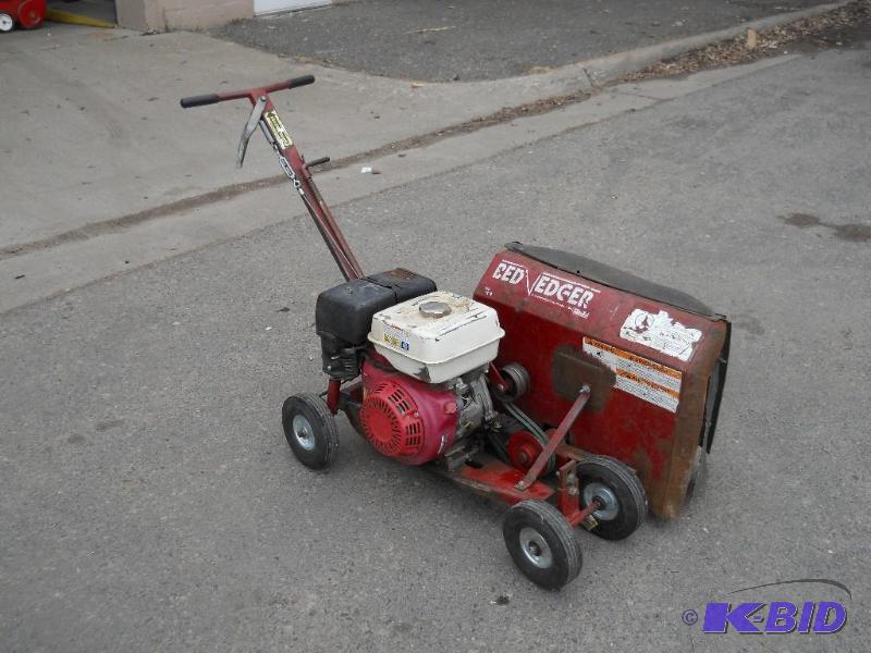 lot 8 image: Brown Bed Edger. Starts and Runs Rear Steering