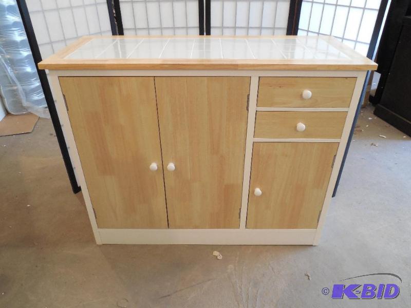 lot 8 image: Ashley Furniture Kitchen Storage Cabinet - White