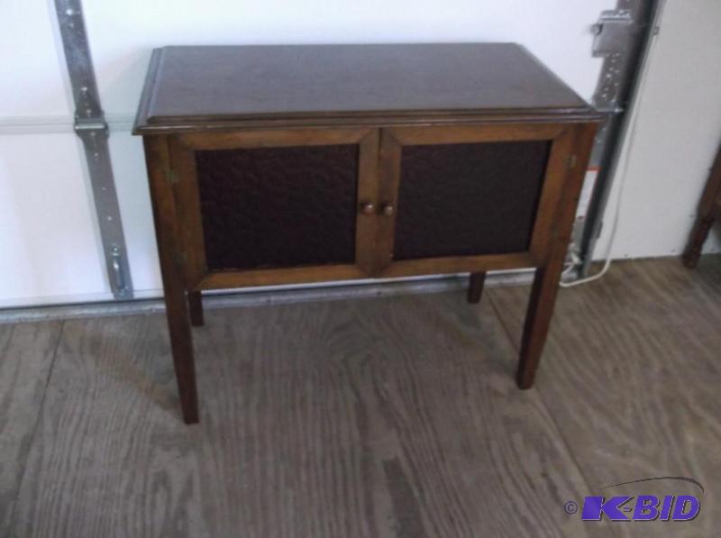 Vintage record cabinet has two plexiglass doo...