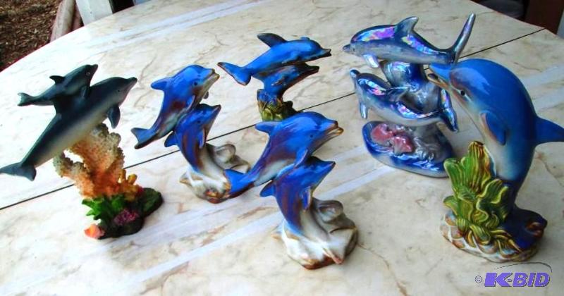 lot 130 image: Assorted dolphin figures, some have chips...