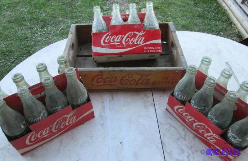 lot 72 image: 3 cases of Coca Cola bottles in a wood Coca C...