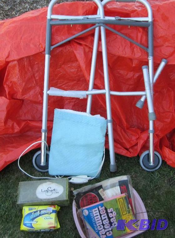 lot 76 image: Walker, heating pad, vintage box of Kleenex...