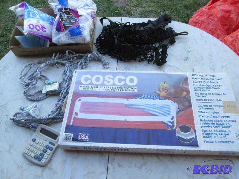 lot 77 image: Cosco child bed rail, napkins, calculator, pl...