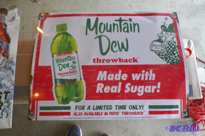 lot 156 image: Metal Mountain Dew Sign from bar