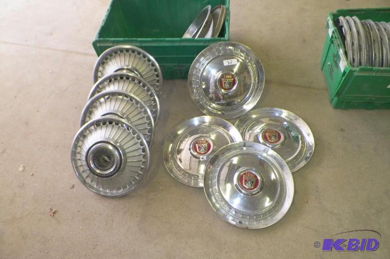 lot 20 image: Tote of 9 1950s Ford and old Camaro Hubcaps