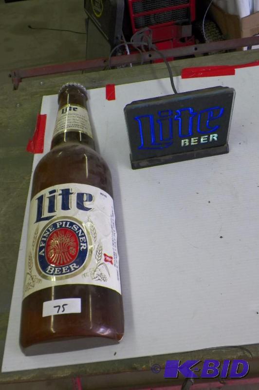 lot 75 image: Miller Lite Lot.  Large Bottle does have issues.