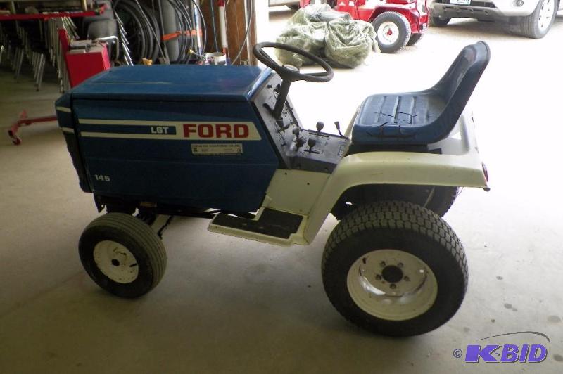 lot 9 image: Ford LGT 145 Yard Tractor.  Starts and runs fine but does need new battery.