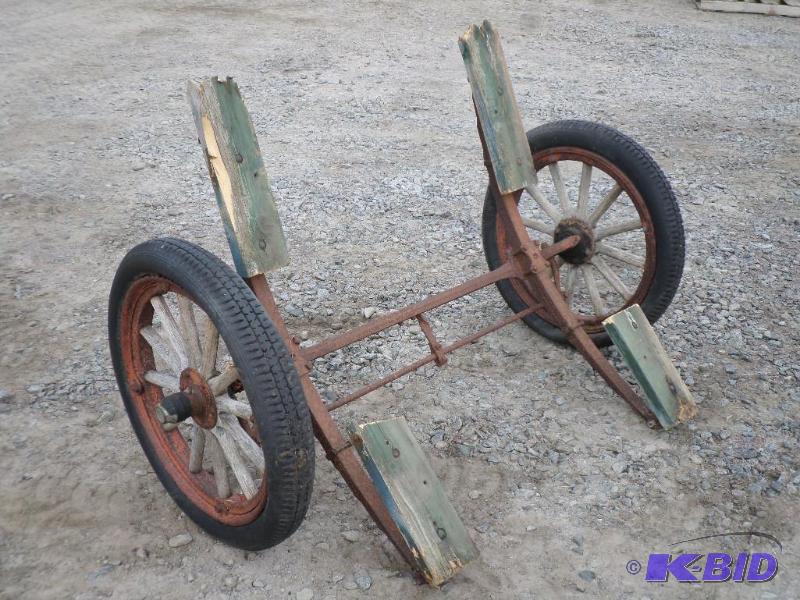 lot 6 image: Antique Wagon Axle With Wood-Spoke Wheels...