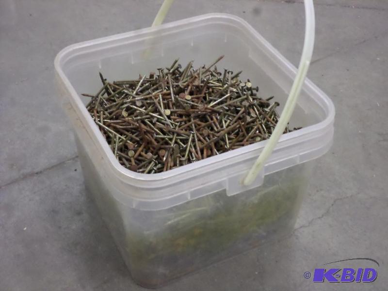 lot 64 image: Buxket Of 2.5" Nails...