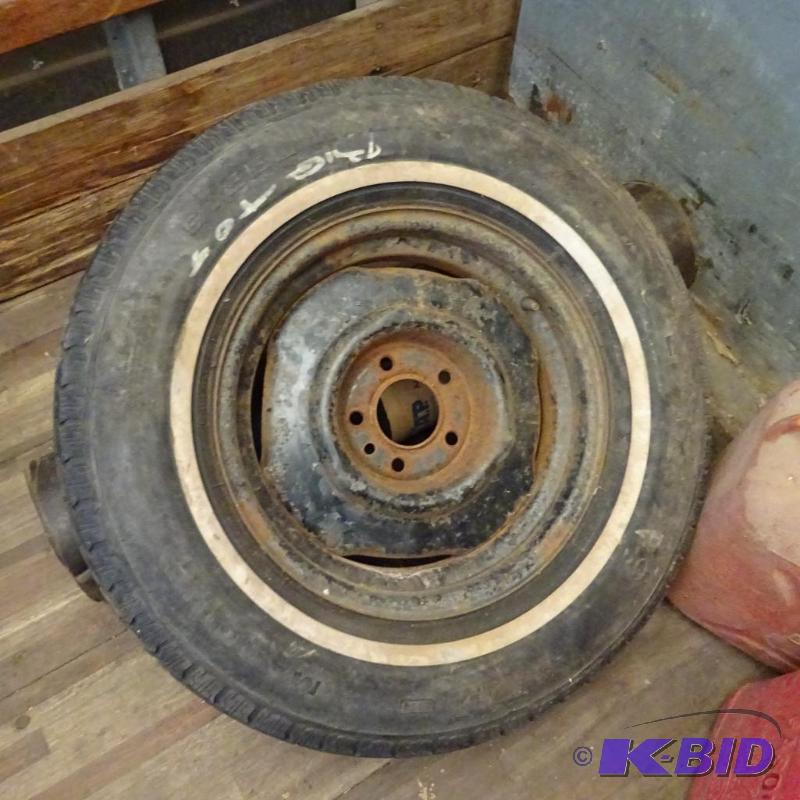 Tire and rim. P22575R15. About 14 tread...