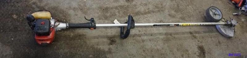 lot 19 image: Red Max Model HEZ24015 Power Edger In Good Co...