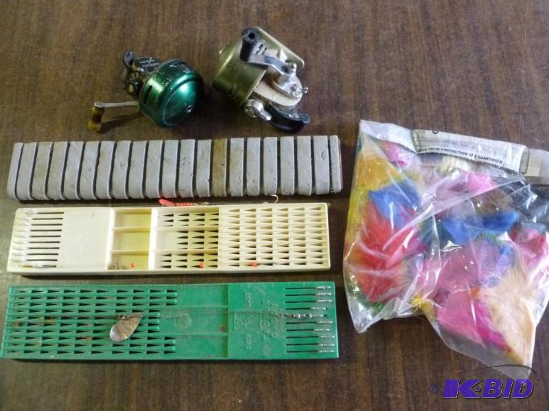 lot 180 image: Lot of fishing items that includes hook caddy...