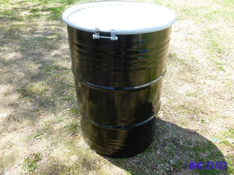 lot 234 image: Large 55 gallon steel barrel, comes with a to...