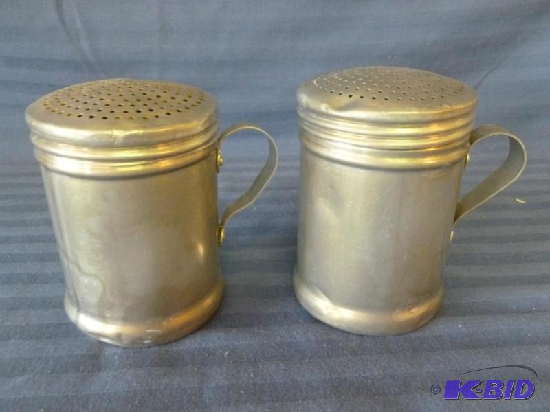 lot 26 image: A pair of large vintage aluminum salt and pep...