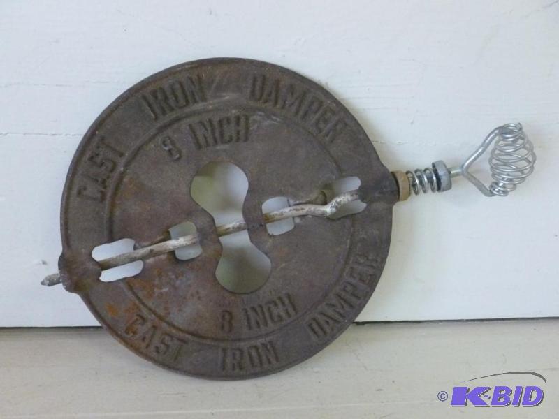 lot 29 image: Vintage cast iron stove damper, 8" acros...