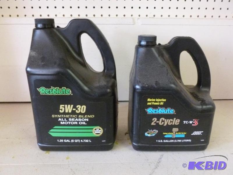 lot 86 image: Partial jug of 5w-30 oil and a partial jug of...