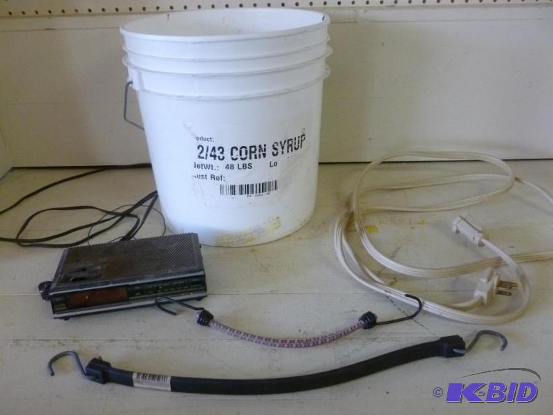 lot 87 image: Lot of electric cord, pail, alarm clock and b...