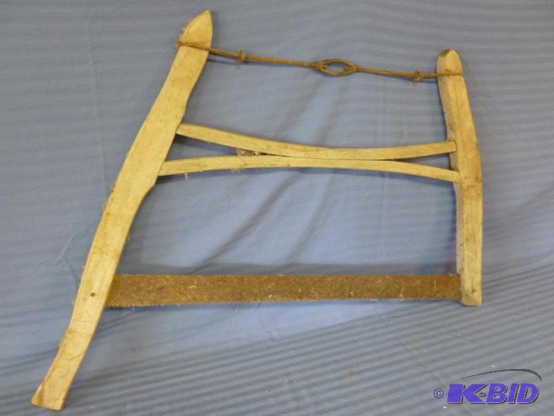 lot 91 image: Vintage wooden buck saw, measures 34" L....