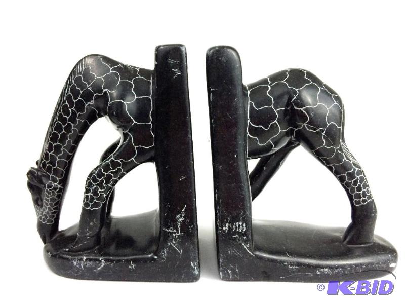 lot 55 image: Hand carved Stone bookends signed too