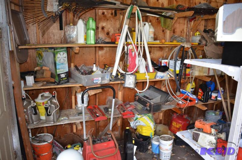 lot 153 image: 3 shelves of items toro S-200 snow blower Yar...