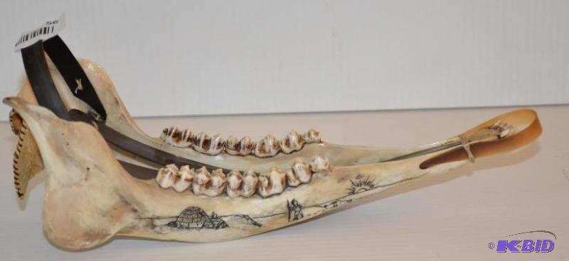 lot 56 image: Eskimo jawbone dogsled trophy 12" long...